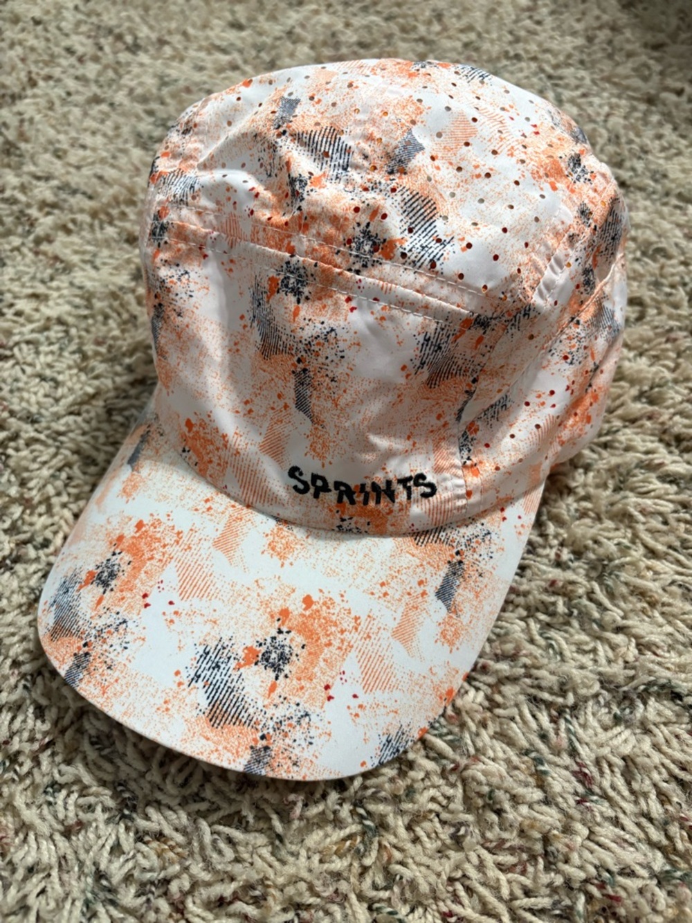 SPRINTS Running Hat White Navy Orange Splatter Print OSFM